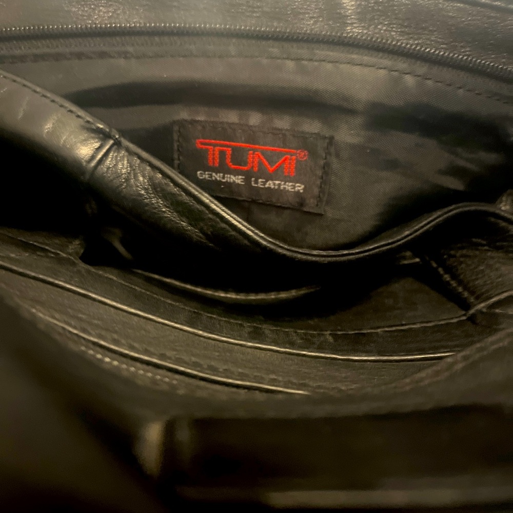 Leather TUMI briefcase w/shoulder strap.